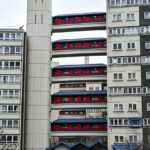 London social housing estate with elevated walkways and residential blocks
