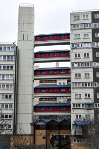 London social housing estate with elevated walkways and residential blocks