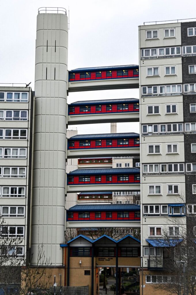 London social housing estate with elevated walkways and residential blocks