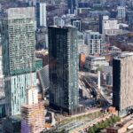 Aerial view of Manchester city centre with modern towers and historic buildings